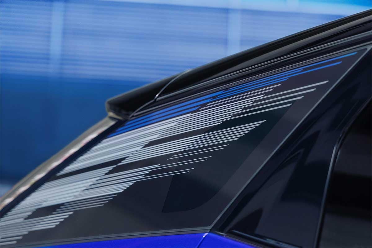 Close-up of the 2027 Cadillac VISTIQ Middle Console Including the Cup Holders, GearClose-up of the Mondrian Pattern on the 2027 OPTIQ-V Rear Quarter Glass