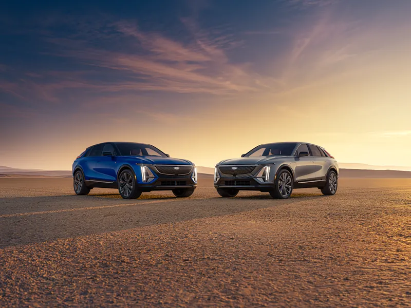 Two 2027 Cadillac LYRIQ Models Parked Side by Side Outdoors.