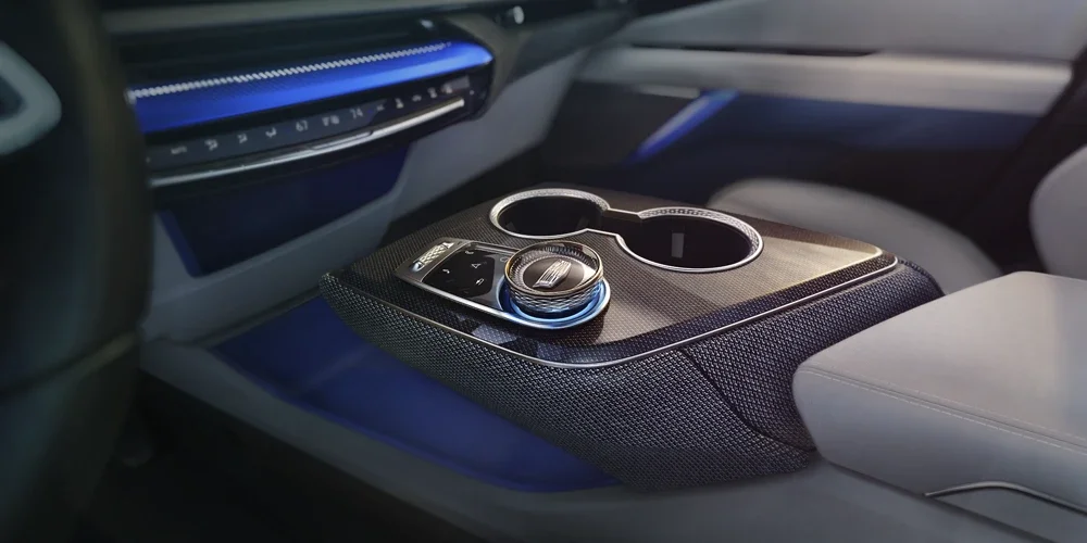 Close-up of the Gear Knob and Cup Holders in the Cadillac OPTIQ's Center Console