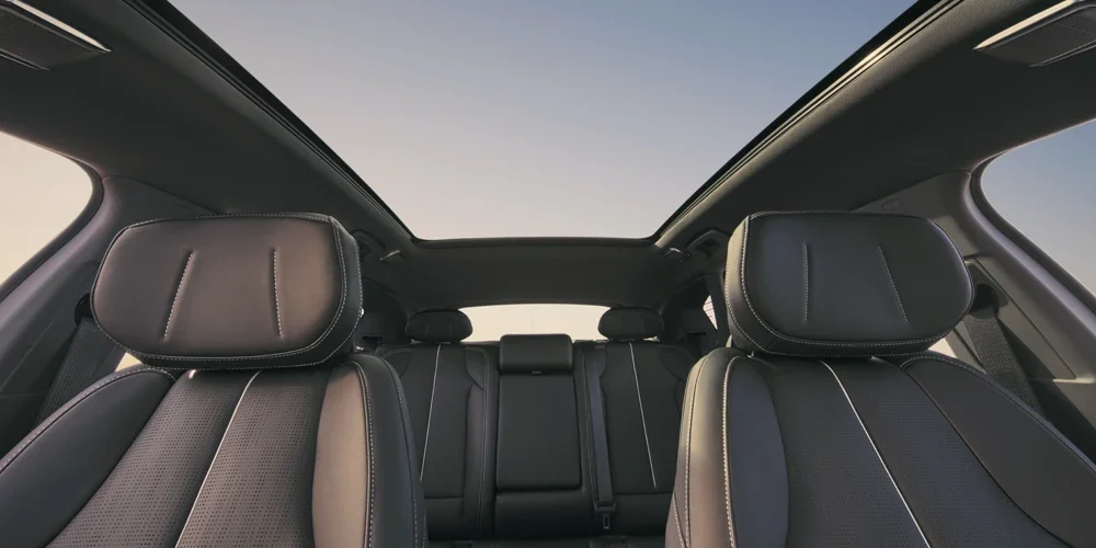 Dashboard View of the Cadillac OPTIQ's Two Rows of Seats and the Skyglass Roof